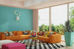 Modern living room with a white sectional sofa, coffee table, and decorative elements.